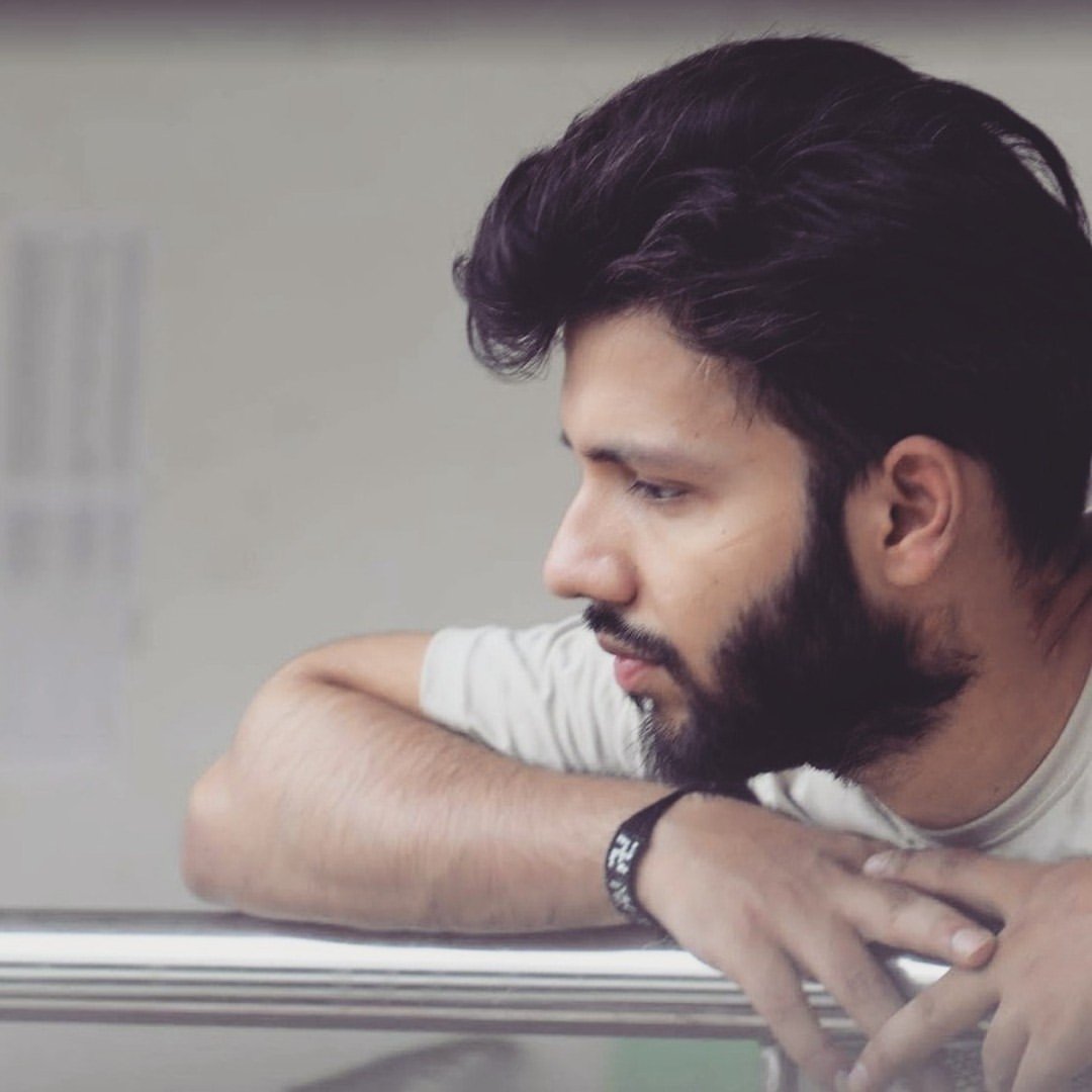 Reflective side-profile portrait of Rohit Jain